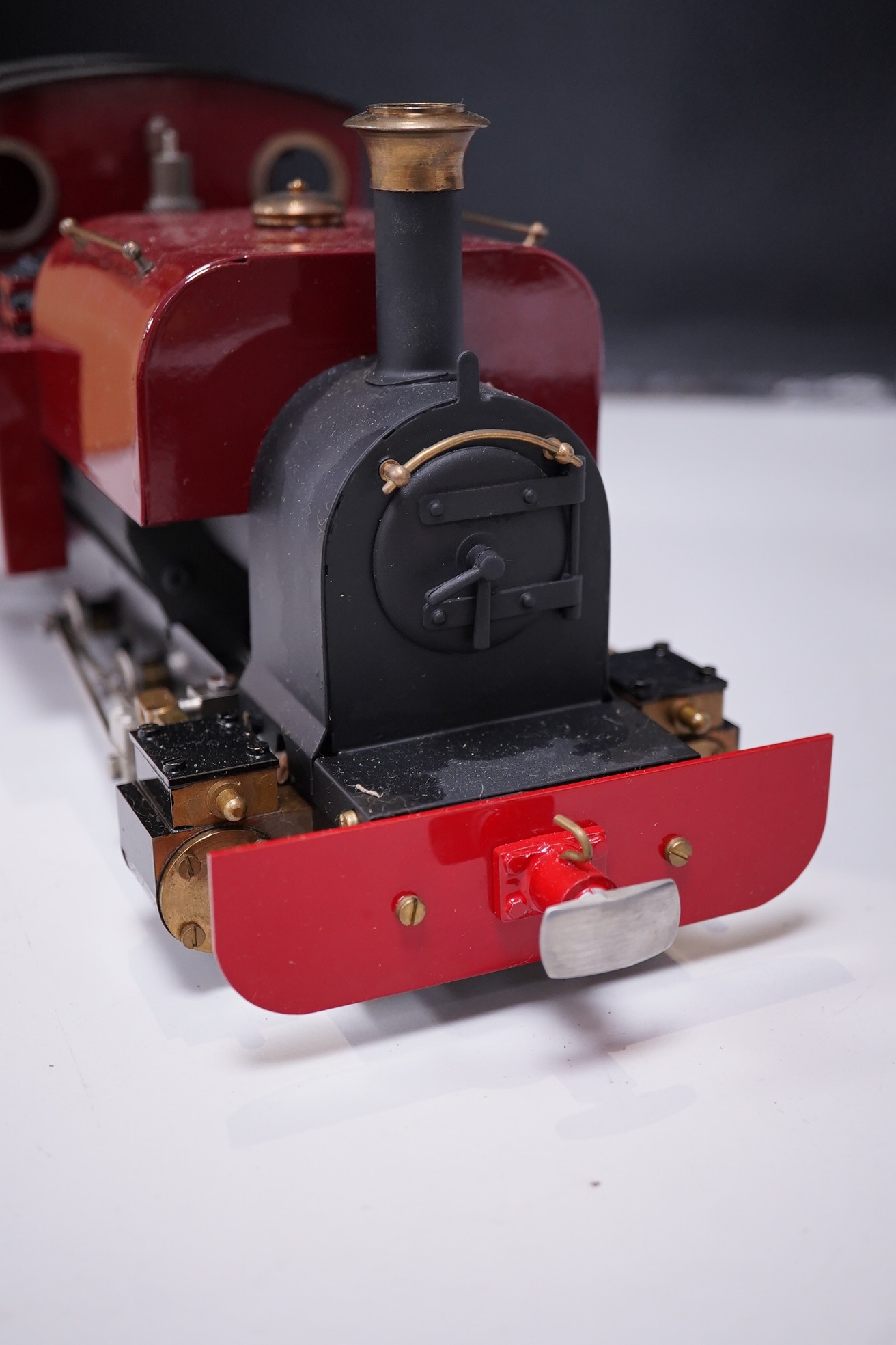 A Roundhouse 16mm scale live steam ‘Dylan’, 0-6-0ST meths fired locomotive for 45mm track, with slip eccentric valve gear, in maroon livery, with owners handbook. Condition - good.